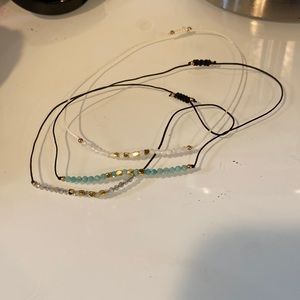 Set of 3 delicate beaded bracelets. Adjustable size